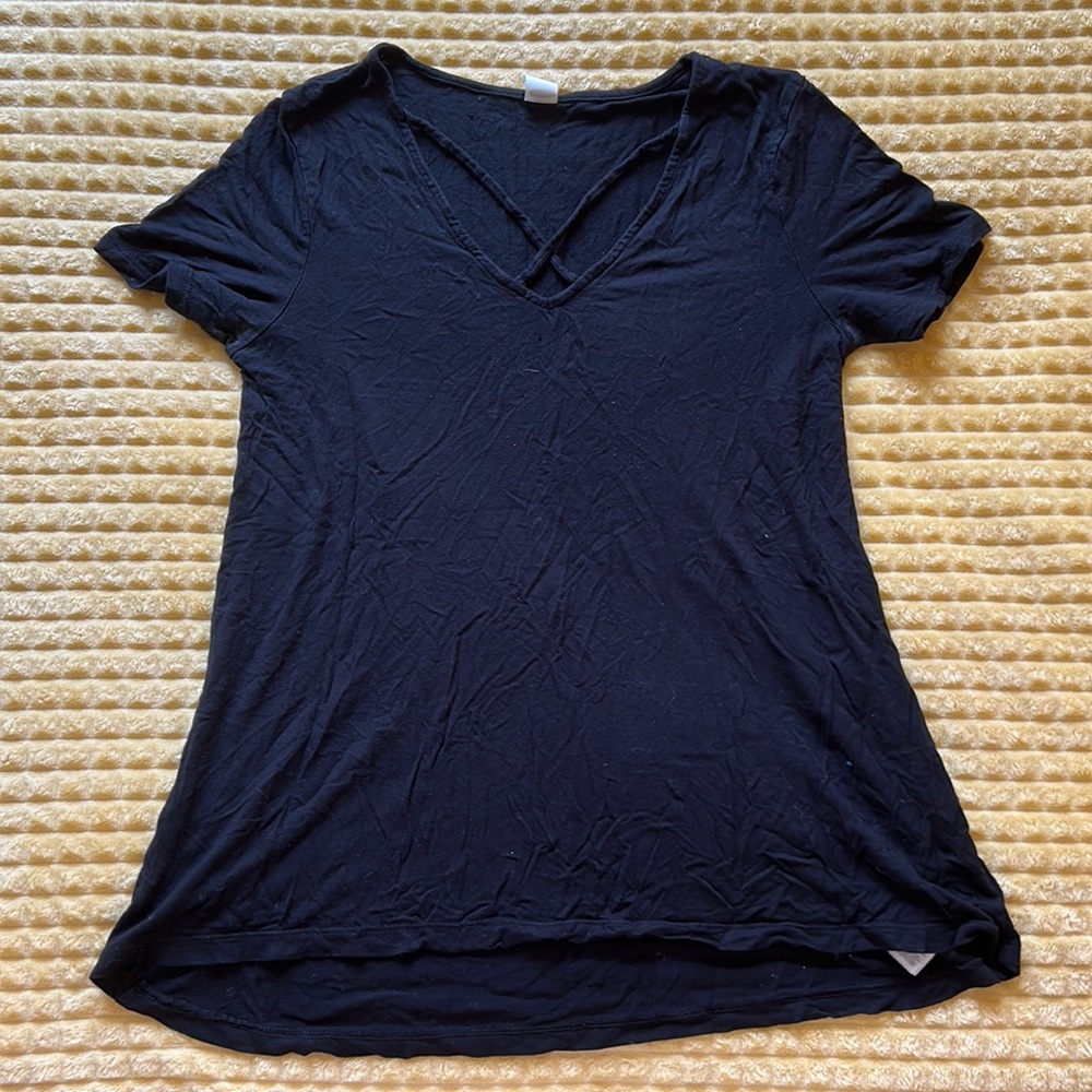 black shirt with cross cross in the front, women’s fit xs